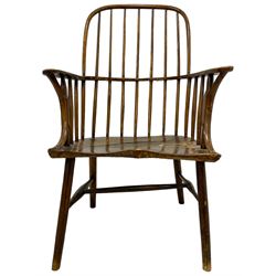 Early 19th century primitive elm and beech Windsor chair, high hoop and stick back over shaped dished saddle seat, raised on cylindrical supports united by swell turned H-stretchers
