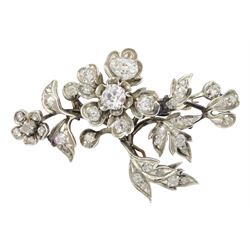 Victorian gold and silver diamond flower spray brooch, the principle flower head with seven vari-cut diamonds of approx 1.85 carat, the largest diamond of approx 0.60 carat