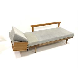 Mid 20th century teak and beech sofa bed / telephone table, loose cushions upholstered in natural grey linen, raised on turned front supports W163cm, H74cm, D76cm
