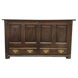 George III oak mule chest, the rectangular hinged top over main panelled compartment, the base fitted with two drawers with brass handles, flanked by fluted uprights terminating in stile feet