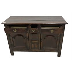 18th century oak dresser base, rectangular top with moulded edge, fitted with three drawers over two arched fielded panelled cupboard doors, on stile supports