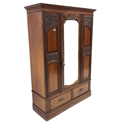 Late Victorian mahogany wardrobe, projecting cornice over panelled and carved front, centre bevelled mirror glazed door, two drawers to plinth base
