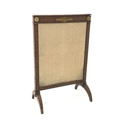 19th century mahogany fire screen, the frame with floral gilt metal mounts and floral marquetry, centred by a glazed cream damask panel and a silk lined rise and fall section, raised on four arched supports 