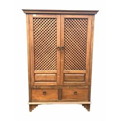 Indian teak floor standing corner cabinet, two doors with lattice panels enclosing two shelves, two drawers under, raised on stile supports, W108cm, D63cm, H157cm.