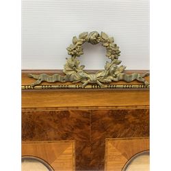 Early 20th century French mahogany and amboyna wood picture frame, the rectangular frame mounted by gilt metal floral wreath casting with extending ribbons, two inner rectangular satinwood panels with oval portrait apertures, gilt metal floral mounts to each corner, enclosed by satinwood band and metal beading 