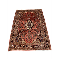 Persian Sarouk full pile red ground Persian Sarouk carpet, with floral medallion 305cm x 200cm