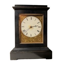 French  - mid-19th century ebonised 8-day campaign clock, with two associated white marble candle sticks, engraved gilt metal dial mask and white dial with Roman numerals and steel moon hands, timepiece movement wound and set from the rear, with pendulum lock. Candle sticks 16cm high.