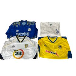 Leeds United football club - twenty-three replica shirts including 1970s 'Arkwright', 1990s Oasics etc