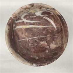 Pink veined marble bowl, of circular form, upon a spreading circular foot, D22cm H12cm