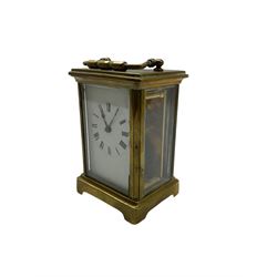 Late 19th century French carriage clock with a timepiece movement and replacement lever platform escapement, enamel dial with Roman numerals and non-matching steel hands.