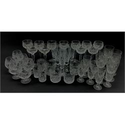 Set of four Waterford tumblers, set of five cut glass hock glasses, unmarked, five Stuart crystal hock glasses, five Stuart crystal champagne flutes together with a part suite of cut glass drinking glasses 