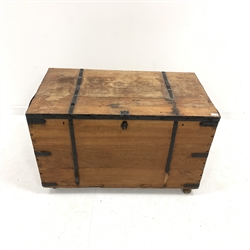 Large stained hardwood metal bound blanket box, with strap iron hinges, carry handle to each end, raised on castors, W106cm, H68cm, D60cm