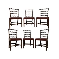 Set six Hepplewhite design mahogany dining chairs, the pierced and waived cresting rail with scrolled foliate carved decoration over ribbon ladder back, seats upholstered in chestnut leather, raised on chamfered supports united by H-stretcher