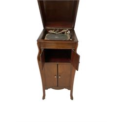 Early 20th century mahogany cased gramophone, rectangular hinged top enclosing gramophone, shaped uprights, fitted with record cupboard and shorter cupboard, with clockwork gramophone fitting as well as electric conversion