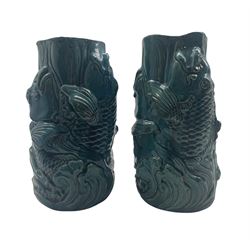 Pair of Ming style Chinese turquoise glazed vases, moulded in relief with fish leaping amongst crashing waves H26cm 
