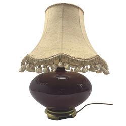 Ceramic lamp on metal foot in burgundy glaze together with tassle shade