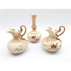 Pair of Locke and Co Worcester jugs painted with birds and flowering branches on a blush ivory ground H14cm and a matching vase with pierced neck H18cm