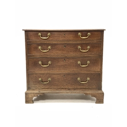 George III oak chest fitted with four long graduated drawers with brass drop handles, raised on bracket supports 