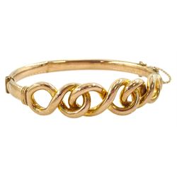 Early 20th century 9ct rose gold infinity link hinged bangle, stamped