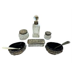 Pair of Victorian embossed oval silver salts with blue glass liners Birmingham 1897, three glass dressing table jars with silver covers and a glass scent flask with silver collar 