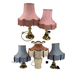 Three various brass table lamps with pink fringed shades and a ceramic vase table lamp (4)
