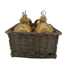 Set of four Victorian stoneware spirit flasks, by Joseph Thompson, Nottingham, 1887, of rounded square form, with plated stoppers, impressed Brandy, Gin, Rum and Whiskey, housed in original four section wicker basket, W26cm, L26cm, H14cm