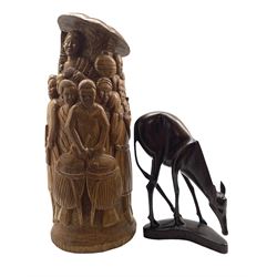 African carved model of an Antelope, a large African carving depicting figures playing musical instruments H56cm and an Eastern folding table (3)