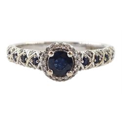 18ct white gold round sapphire and diamond cluster ring, with sapphire and diamond set shoulders, hallmarked, retailed by Emmy London, boxed with certificate