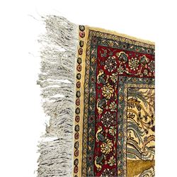 Hereke tree of life design silk rug, the field with tree of life within Mirab, decorated profusely with flower heads and trailing branches, crimson ground guarded border decorated with repeating flower heads and foliate motifs, signature panel to the top outer edge