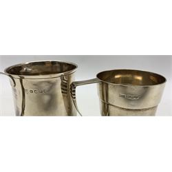 George III silver baluster mug with loop handle H10cm London 1812 and another of ribbed tapering design engraved with initials H8cm Sheffield 1963 Maker Walker & Hall 8oz (2) 