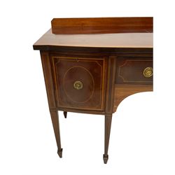 Edwardian mahogany bow-front sideboard, raised back and top with boxwood stringing and satinwood band, fitted with two drawers and cupboard, on square tapering supports with spade feet