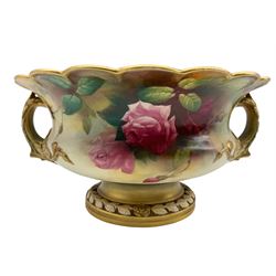 Early 20th century Royal Worcester twin handled footed bowl of squat baluster form with scalloped rim, hand painted with roses, unsigned, upon pedestal base,  with puce printed marks beneath including shape number 2344, and date code for 1910, L29cm x H13cm