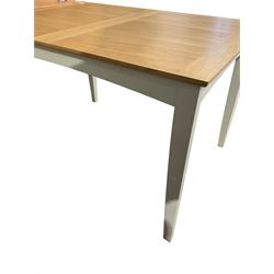 Light oak drawer leaf extending dining table, on light grey finish base