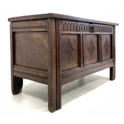 17th century oak coffer, three panel lid lifting to reveal plain interior over lunette carved frieze and three panelled lozenge carved front, raised on stile supports W111cm, H63cm, D49cm