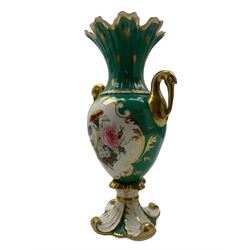 Mid 19th century Rockingham Stork handled vase, painted with flowers reserved on a gilt and green ground, printed marked beneath, H28cm and another, painted with a river landscape and flowers, reserved on a gilt and blue ground, H26cm (2)