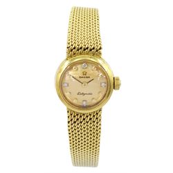 Omega Ladymatic 18ct gold manual wind wristwatch, 24 jewels movement, Cal. 661, Ref. 7515851, champagne dial with diamond dot hour markers at 12, 3, 6 and 9 o'clock, on integral 18ct gold bracelet, London 1966, with guarantee card dated 1974