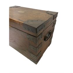 Late 19th century oak and metal bound silver chest, the hinged lid with brass plaque inscribed with monogram, fitted with wrought iron carrying handles 