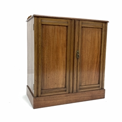 Early 20th century mahogany two door cupboard, with raised back and two fixed shelves, skirted base, W76cm, H86cm, D40cm