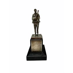 White metal figure of a soldier on a silver mounted ebonised plinth with inscription to Col. A J McClay from the Yorkshire Volunteers 1954, silver cigarette box similarly inscribed, two plated trays and two tankards to Col McClay