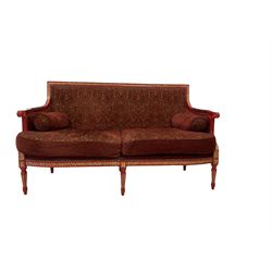 French style sofa, the red and gilt painted show frame with red upholstery, raised on turned and reeded supports  