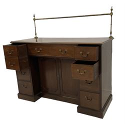 George III mahogany sideboard, raised brass rail over rectangular top with moulded edge, fitted with an assortment of eight drawers including a cellarette function, surrounding a recessed double cupboard, on skirted base