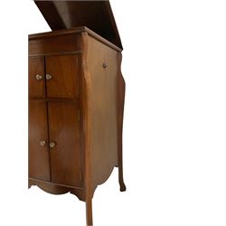 Early 20th century mahogany cased gramophone, rectangular hinged top enclosing gramophone, shaped uprights, fitted with record cupboard and shorter cupboard, with clockwork gramophone fitting as well as electric conversion