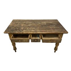 Late 19th century rustic pine table, rectangular top with rounded corners, fitted with three drawers, raised on turned supports