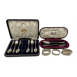 Set of six silver coffee spoons and tongs Birmingham 1924 Maker Daniel and Arter, cased, silver christening spoon and fork , cased, and three silver serviette rings