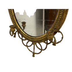 Victorian oval wall mirror with two candle sconces in a gilt frame with rope twist decoration