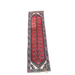 Caucasian design runner, red field with black and blue geometric design, enclosed by border 76cm x 183cm