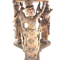 20th century Burmese carved hardwood occasional table, the circular top decorated with interlaced foliate, dragons, elephants, centred by stylised seated and reclining figures, raised on three figural uprights leading to trefoil base, D65cm, H61cm