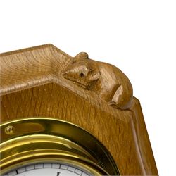 Mouseman - oak and brass wall clock, circular Roman dial in brass drum on moulded octagonal mount carved with mouse signature, fitted with battery operated Quartz movement, by the workshop of Robert Thompson, Kilburn