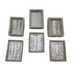Three 18th/ 19th century blue and white rectangular boxes, all having inscriptions to the interior and scrolled decoration to the cover, L9.5cm max (3)