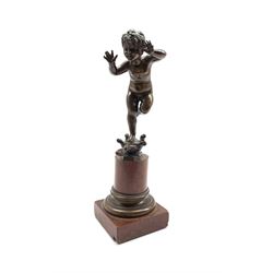 After Hans Parzinger (German 1886-1958): bronze study of a young boy, standing on a tortoise on marble base, impressed marks H22cm